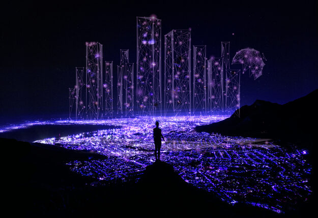 Glowing lights surrounded by darkness with person standing in the middle